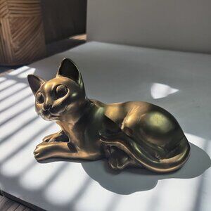 Cat in Bronze delightfully awaiting its next adventure. Heavy, 5.25" L, 3.25 H